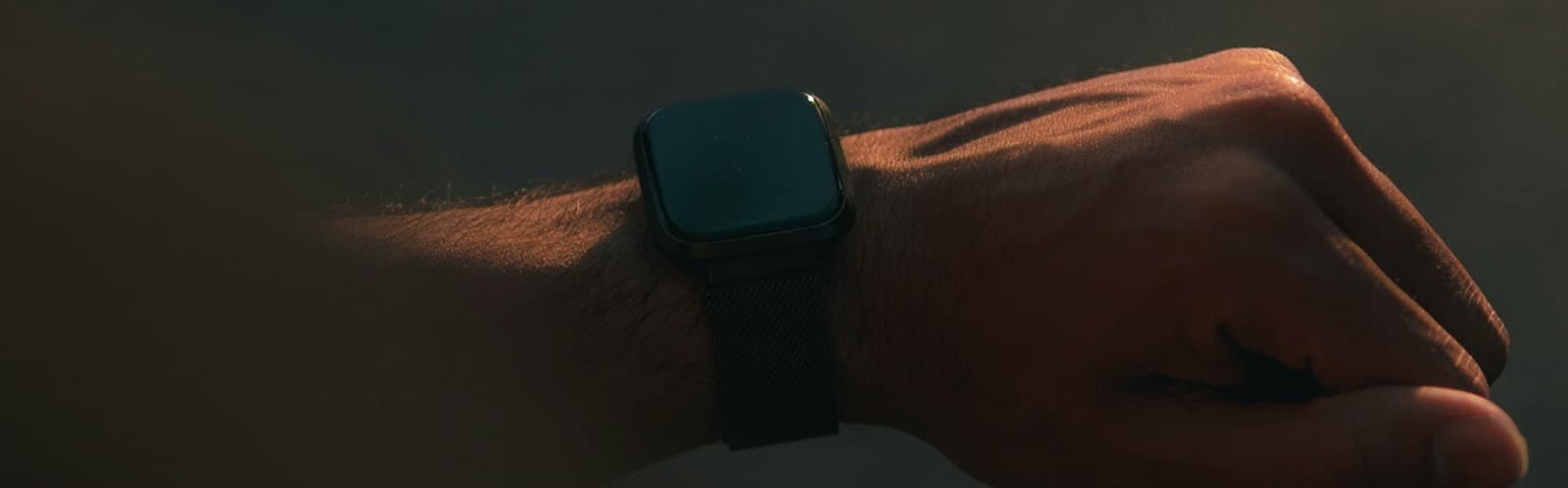 Close-up of a wearable on a member's wrist